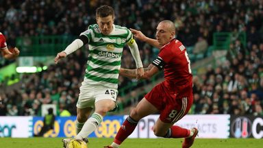Glasgow, Scotland - NOVEMBER 28: Celtic Callum McGregor is under pressure from Scott Brown (right) of Aberdeen during the Premier League match between Celtic and Aberdeen at Celtic Park, on November 28, 2023, in Glasgow, Scotland.  (Photo by Alan Harvey/SNS Group)